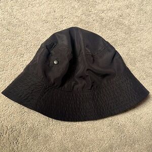 Black nylon bucket hat with small pockets
